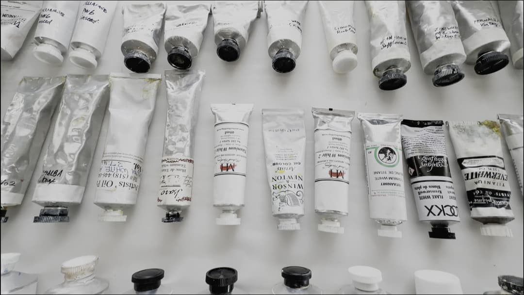 Tubes of white paint made from various pigments