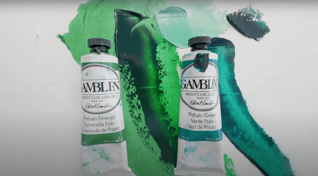 Two tubes of Gamblin paints. Both are phthalo green, but one is the yellowish shade (a bright shamrock green) and the other is phthalo green blue shade, which is a deep blue-green.