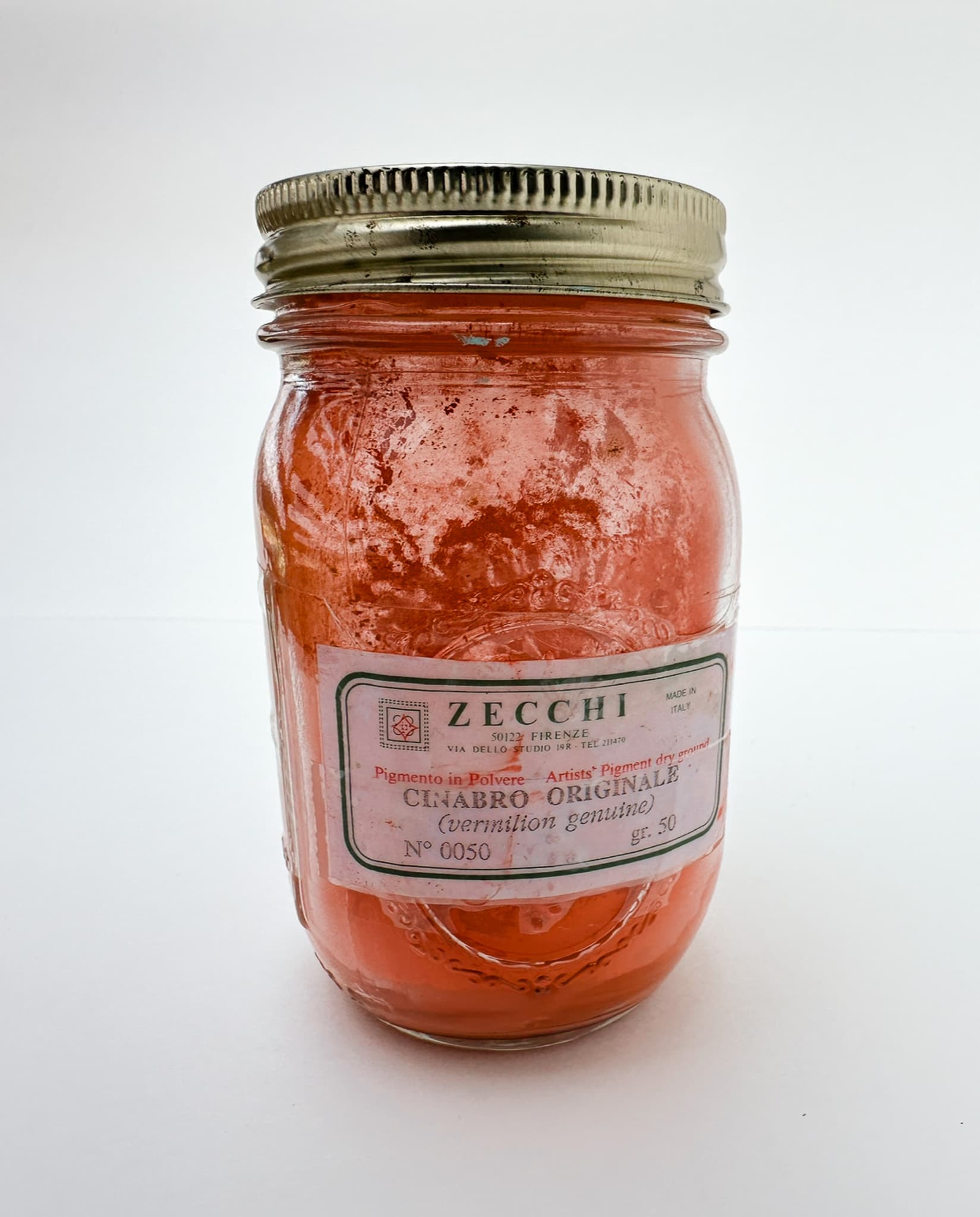 A jar of genuine vermilion pigment