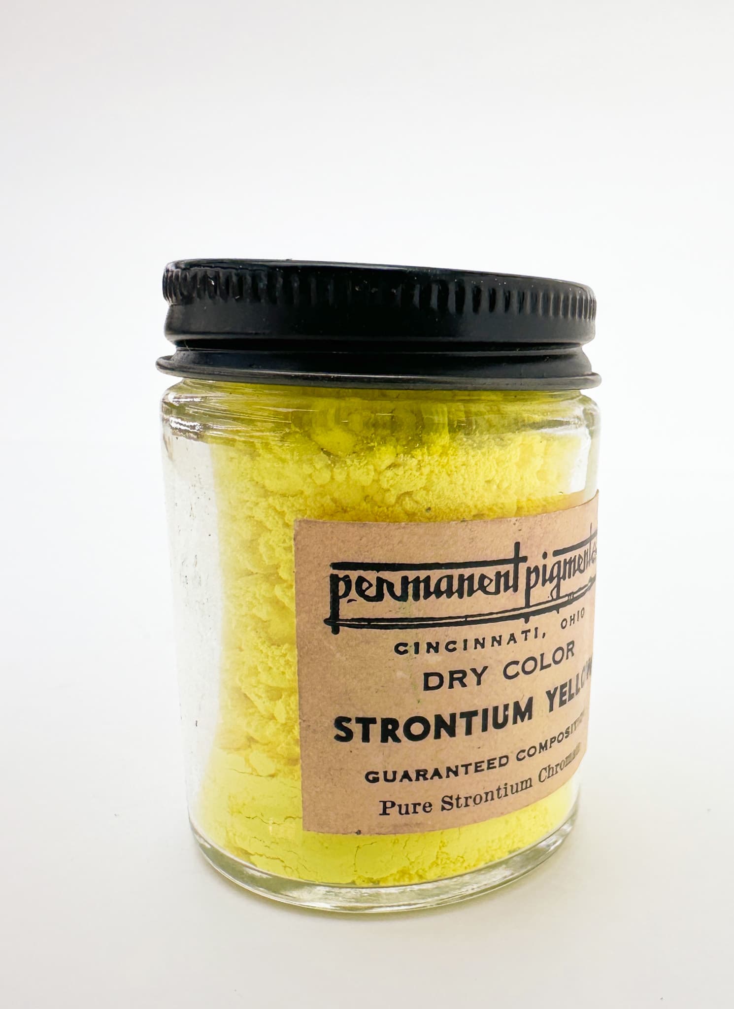 A vintage jar labeled Strontium Yellow