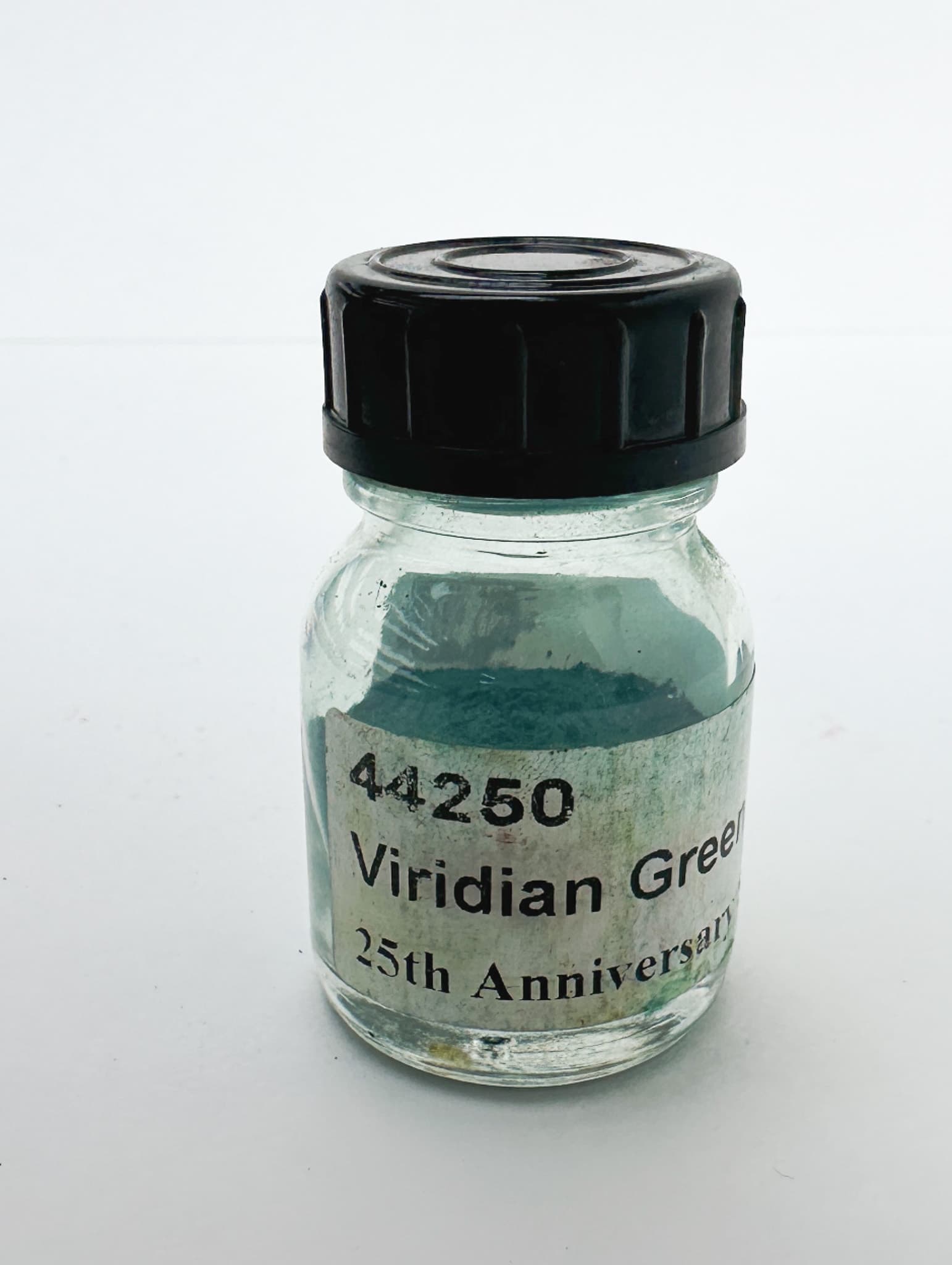 A small bottle of Viridian dry pigment