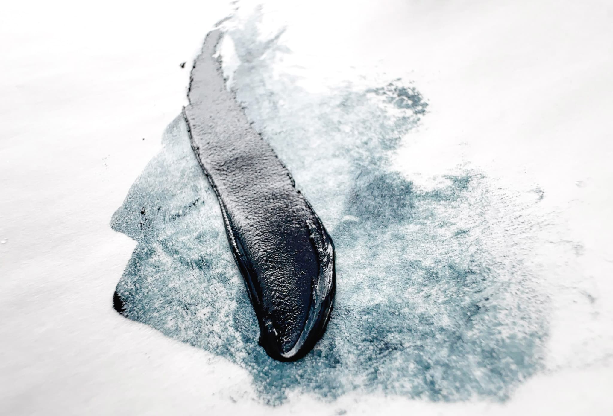 A bit of Vivianite or Genuine Blue Ochre oil paint where the thin area is both filmy a gritty. In a daub it shows a deeper solid navy color