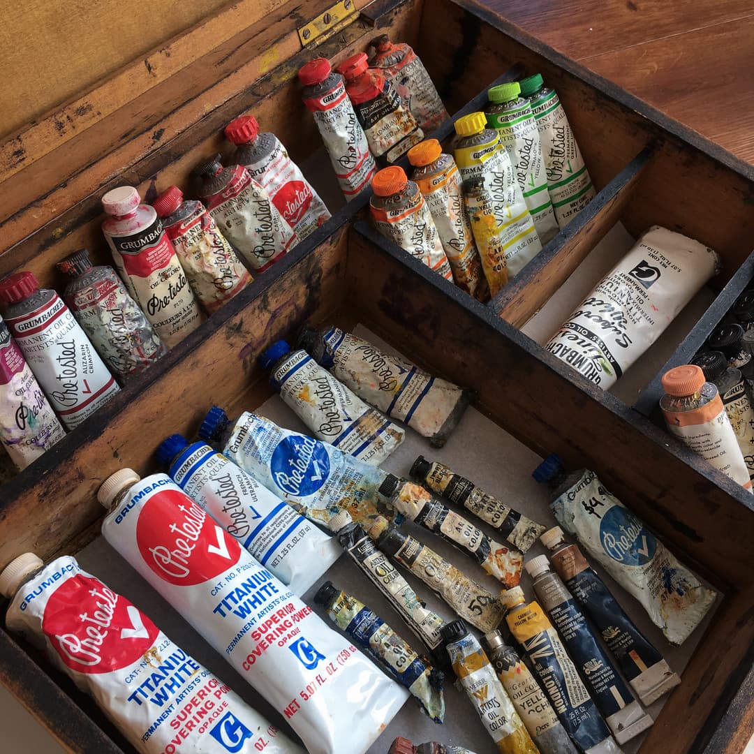 An old paintbox filled with historical oil paints