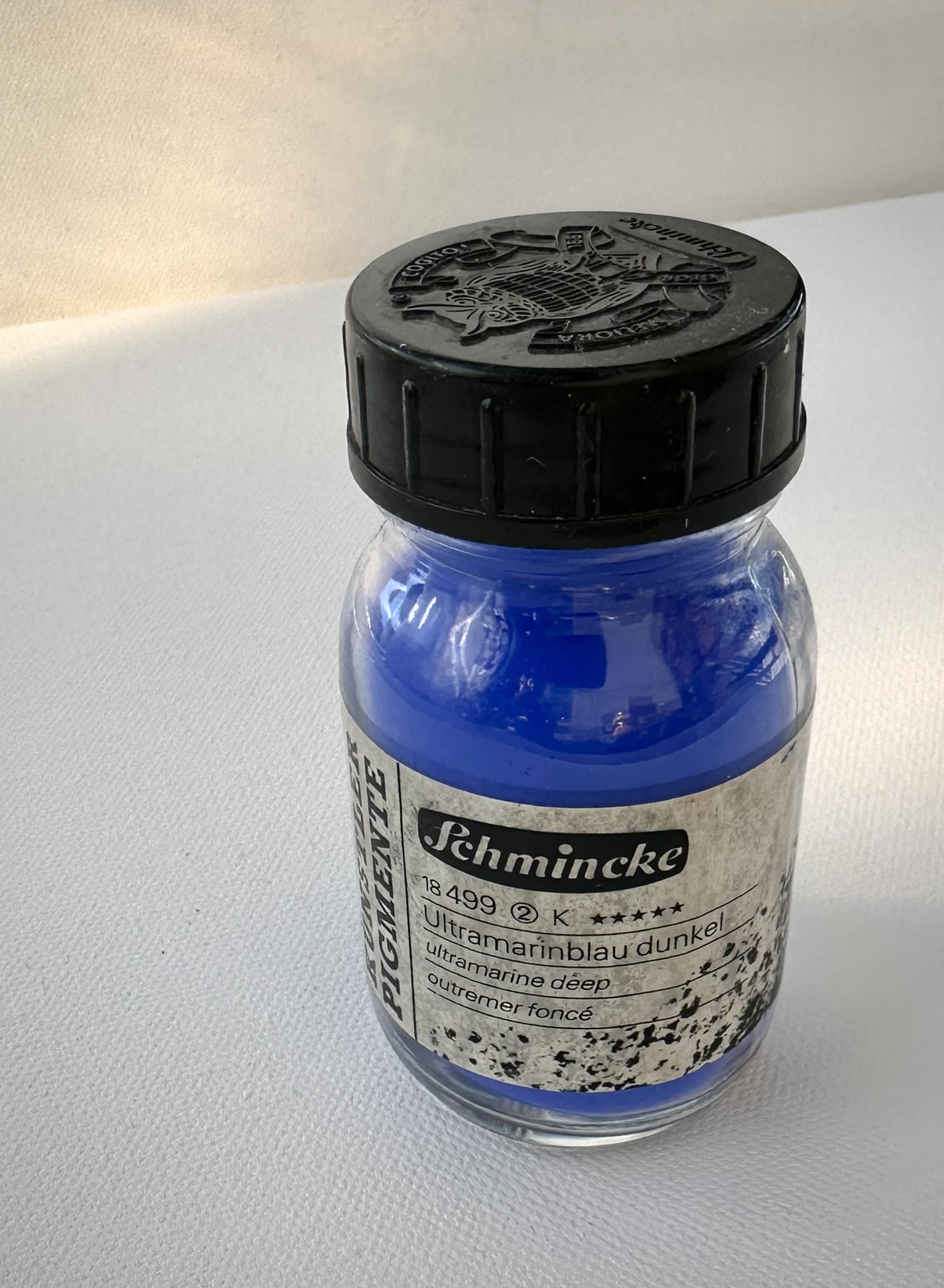 A jar of dry pigment, PB29