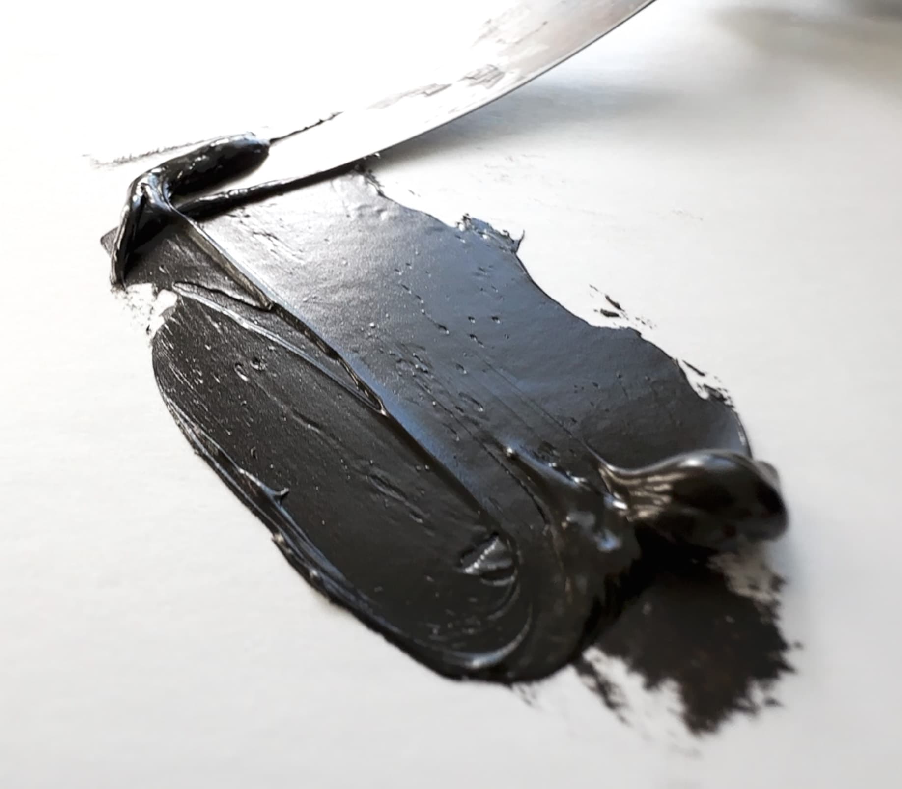 A swoosh of brown oxide oil paint