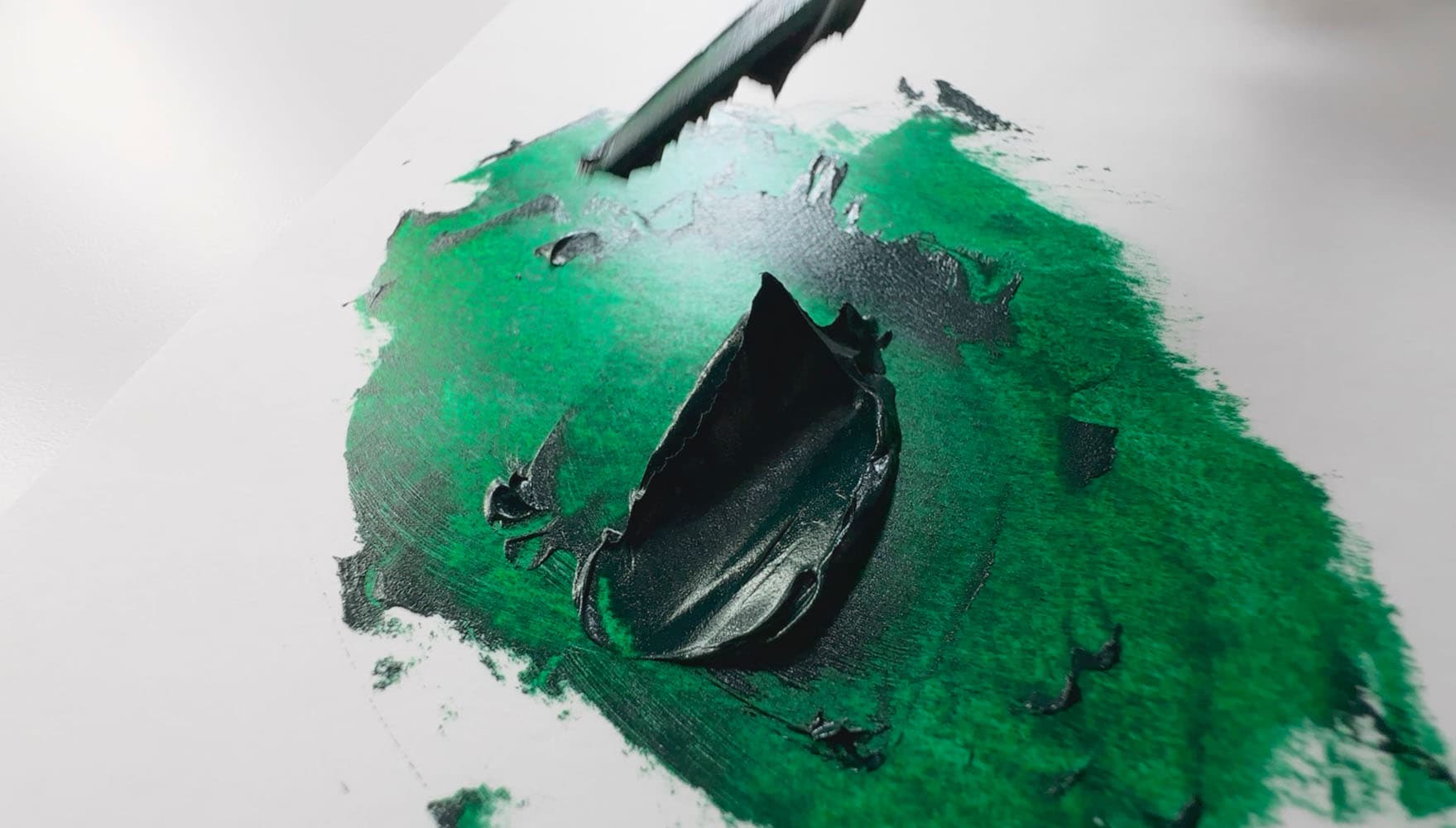 A daub of green oil paint made from PG36