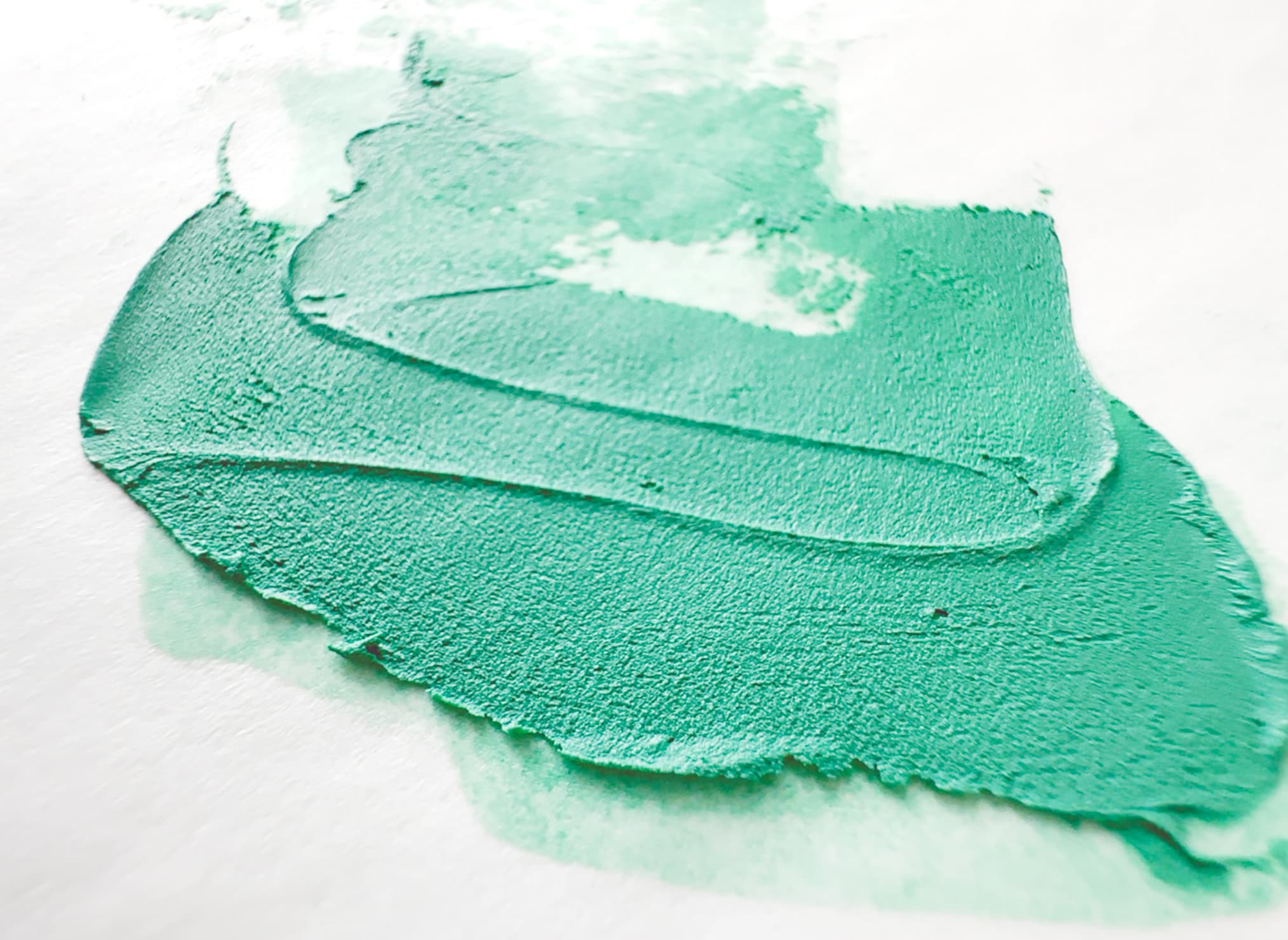 A swatch of pale green oil paint made of Malachite