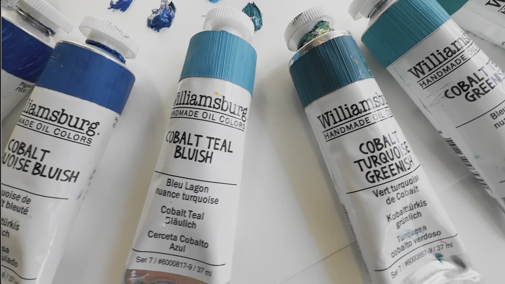 An array of Williamsburg paint colors made with different cobalt pigments ranging from deep blue to turquoise green