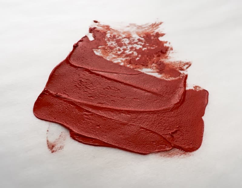 Gritty bright red oil paint