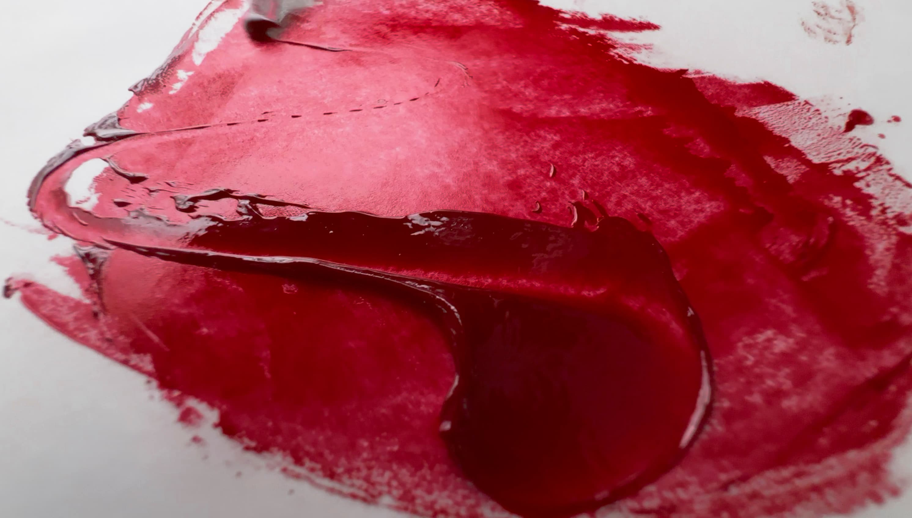 A dollop of deep crimson oil paint made with Anthraquinone Red