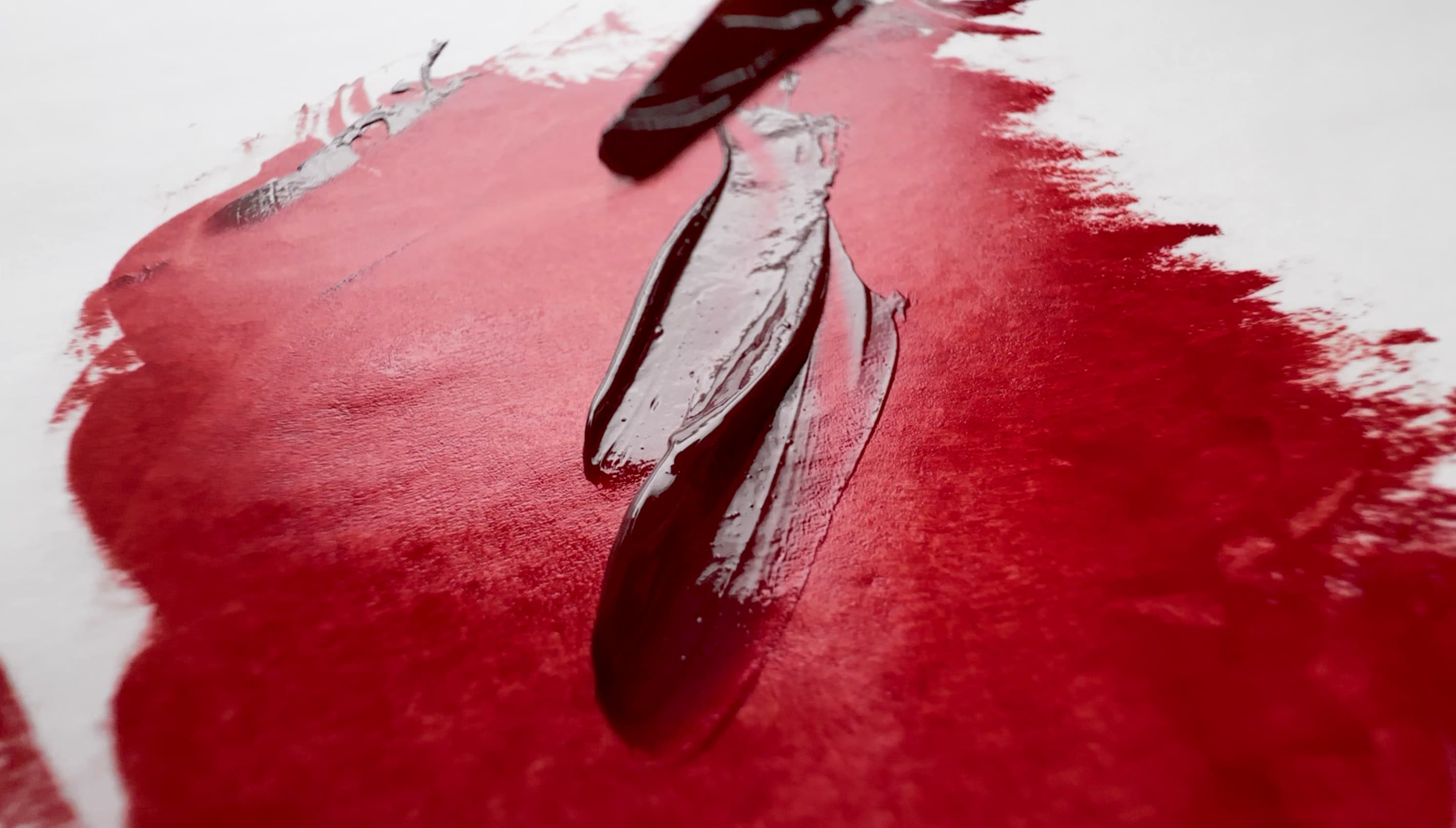 Impasto daubs of Perylene Maroon oil paint pulled with a palette knife