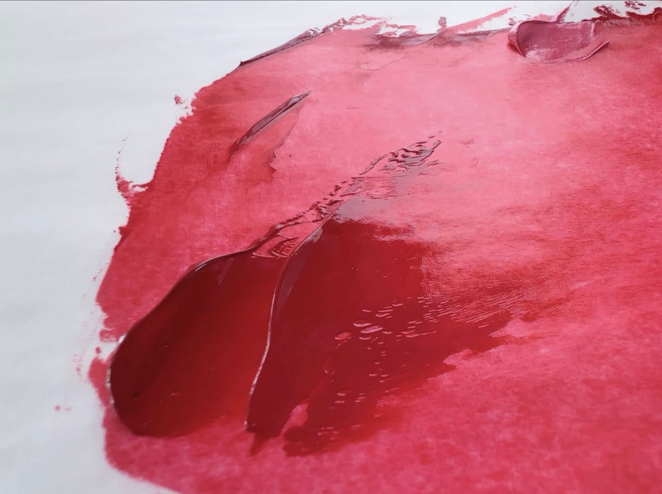 Daubs of bright red oil paint