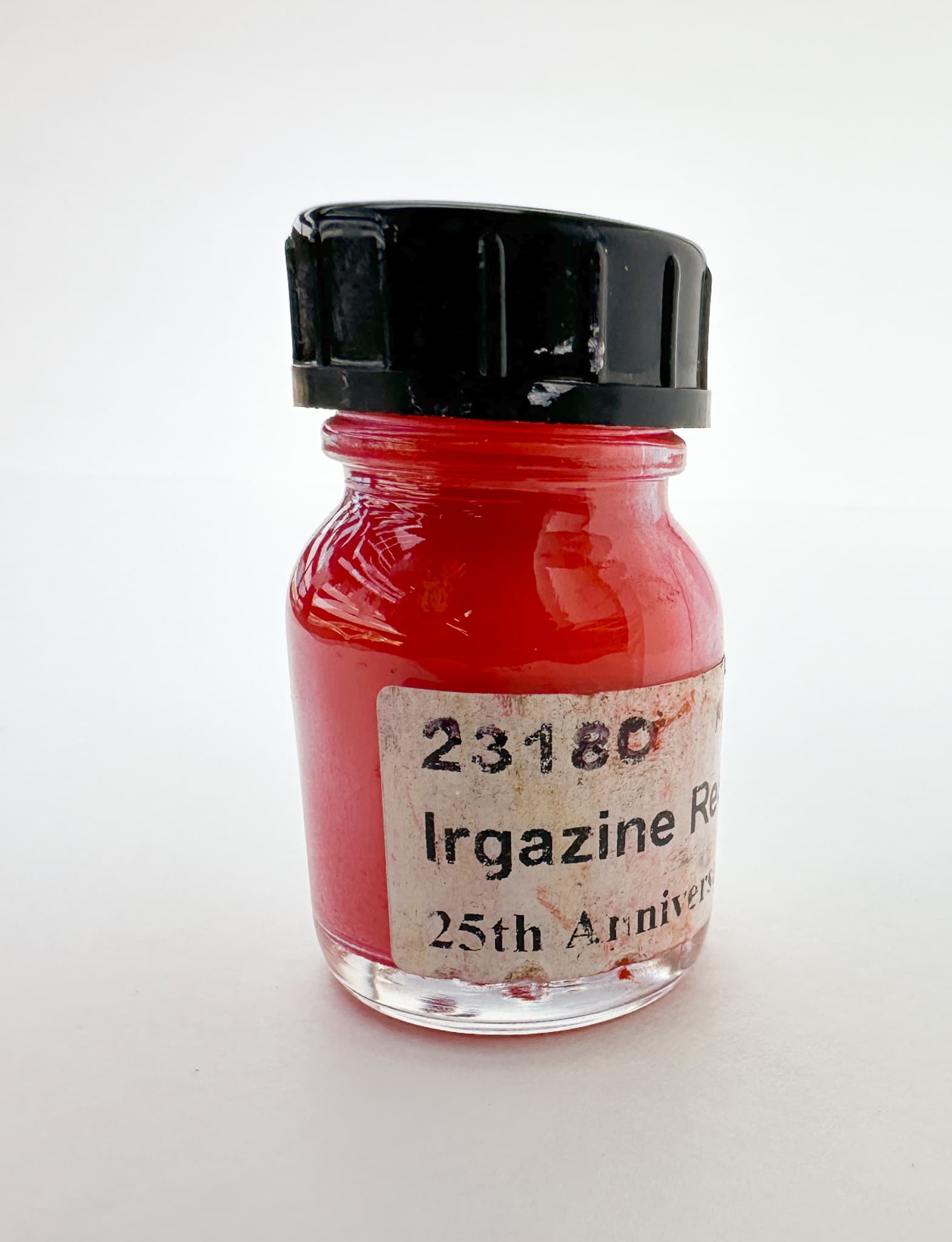 A bottle of Pyrrole Red dry pigment