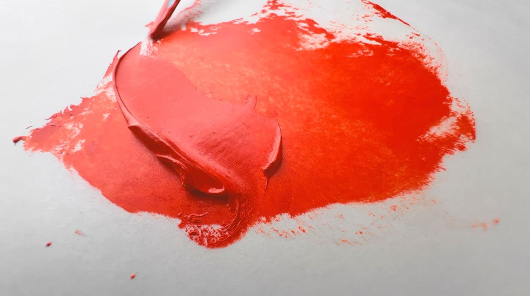 A stroke of Pyrrole Red oil paint