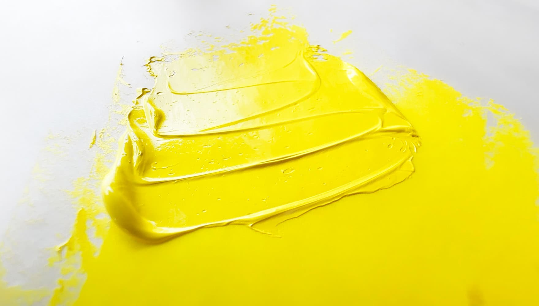 A swatch of bright yellow oil paint