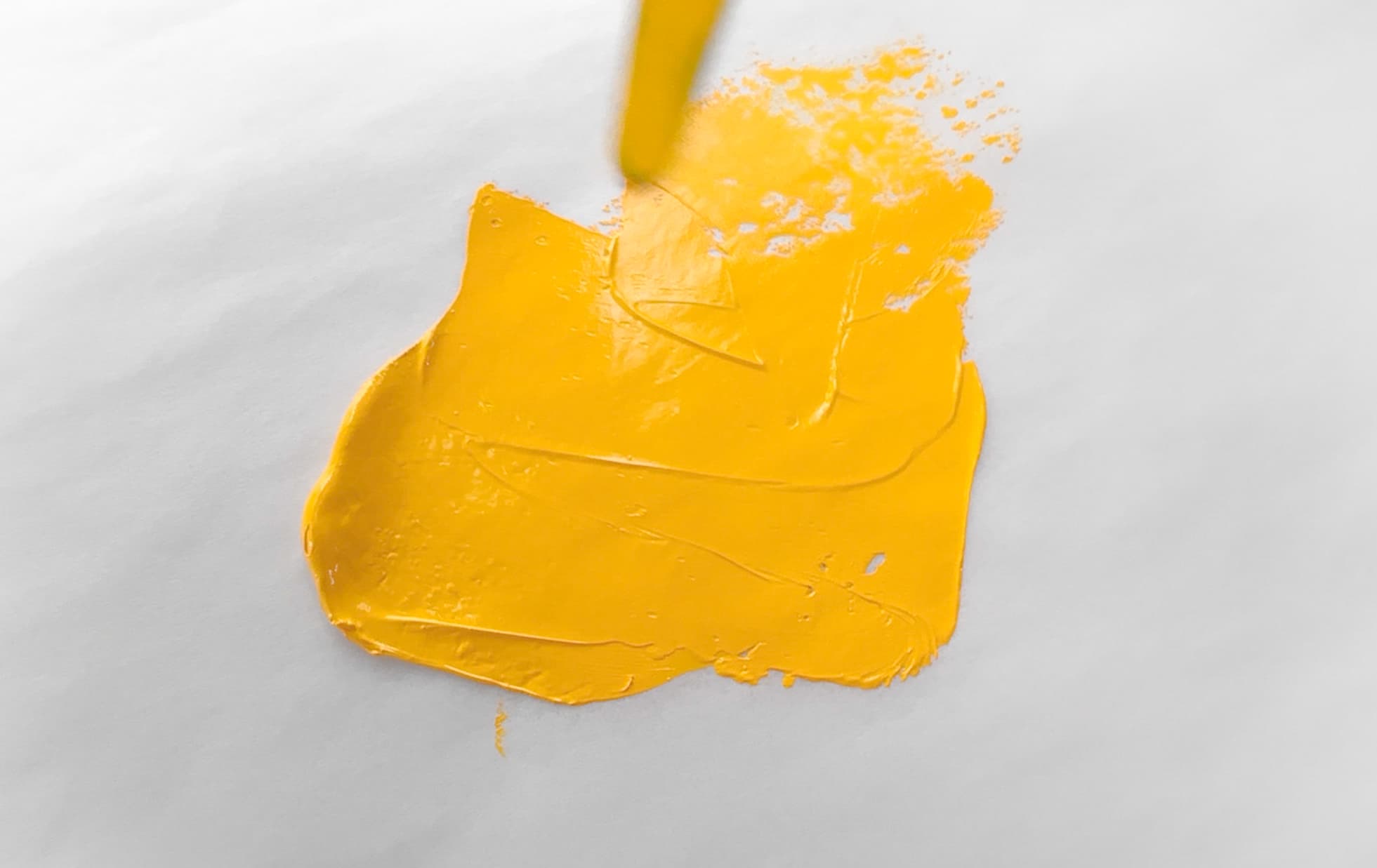 A daub of yellow-orange oil paint