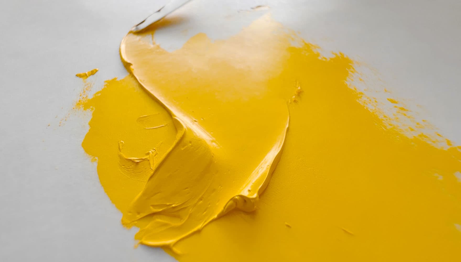 An impasto stroke of Cadmium Yellow Oil paint