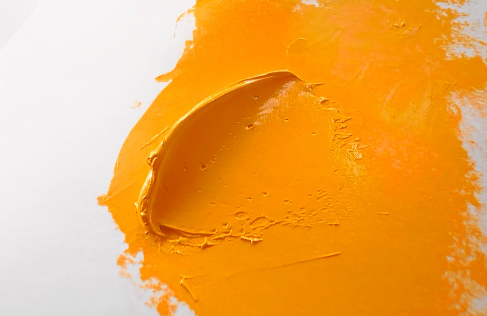 A dollop of yellow-orange Hansa Yellow Deep, PY65, in oil paint